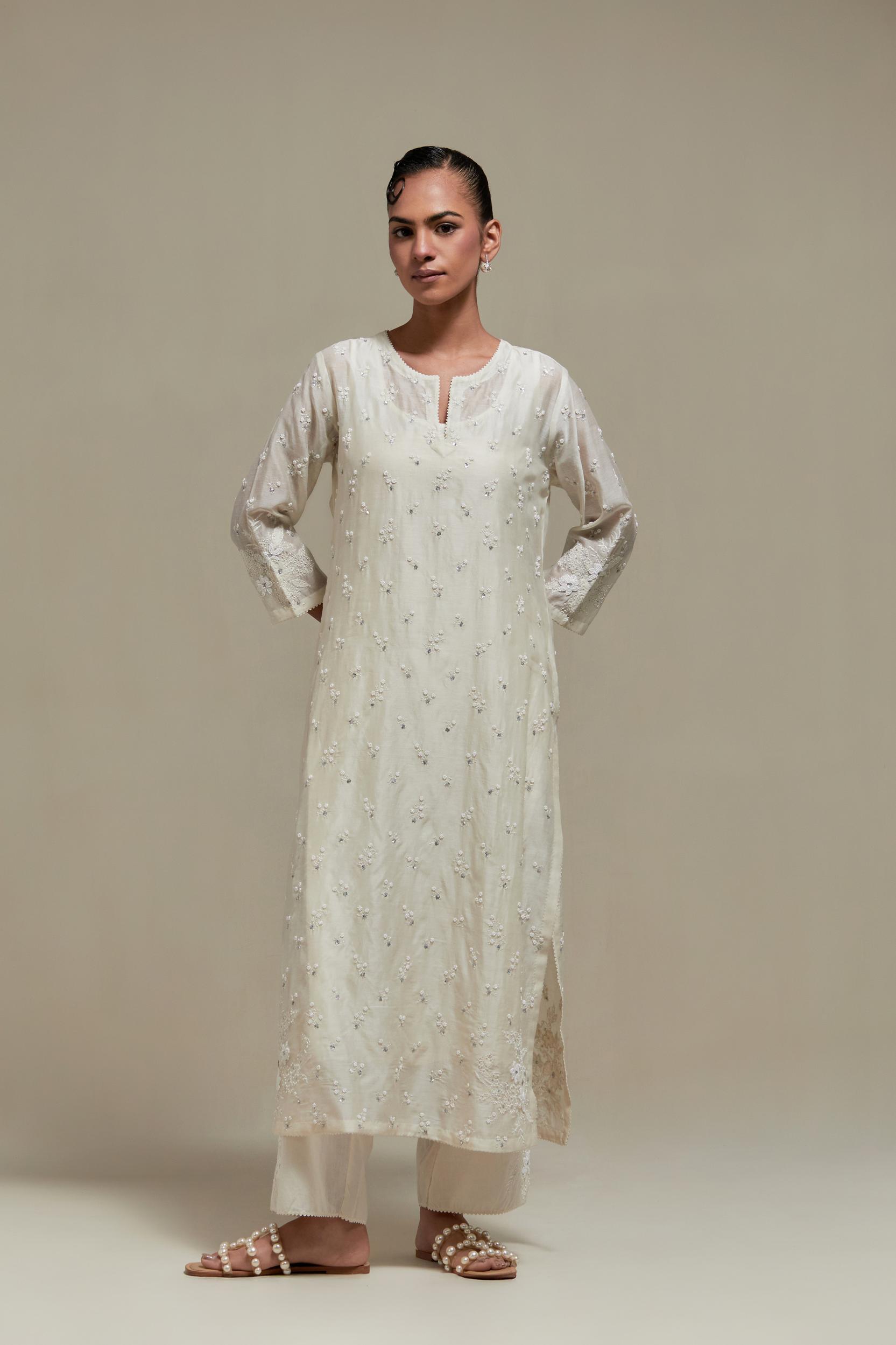 Off white silk Chanderi straight kurta set with all-over delicate embroidered flowers, highlighted with sequins and beads.