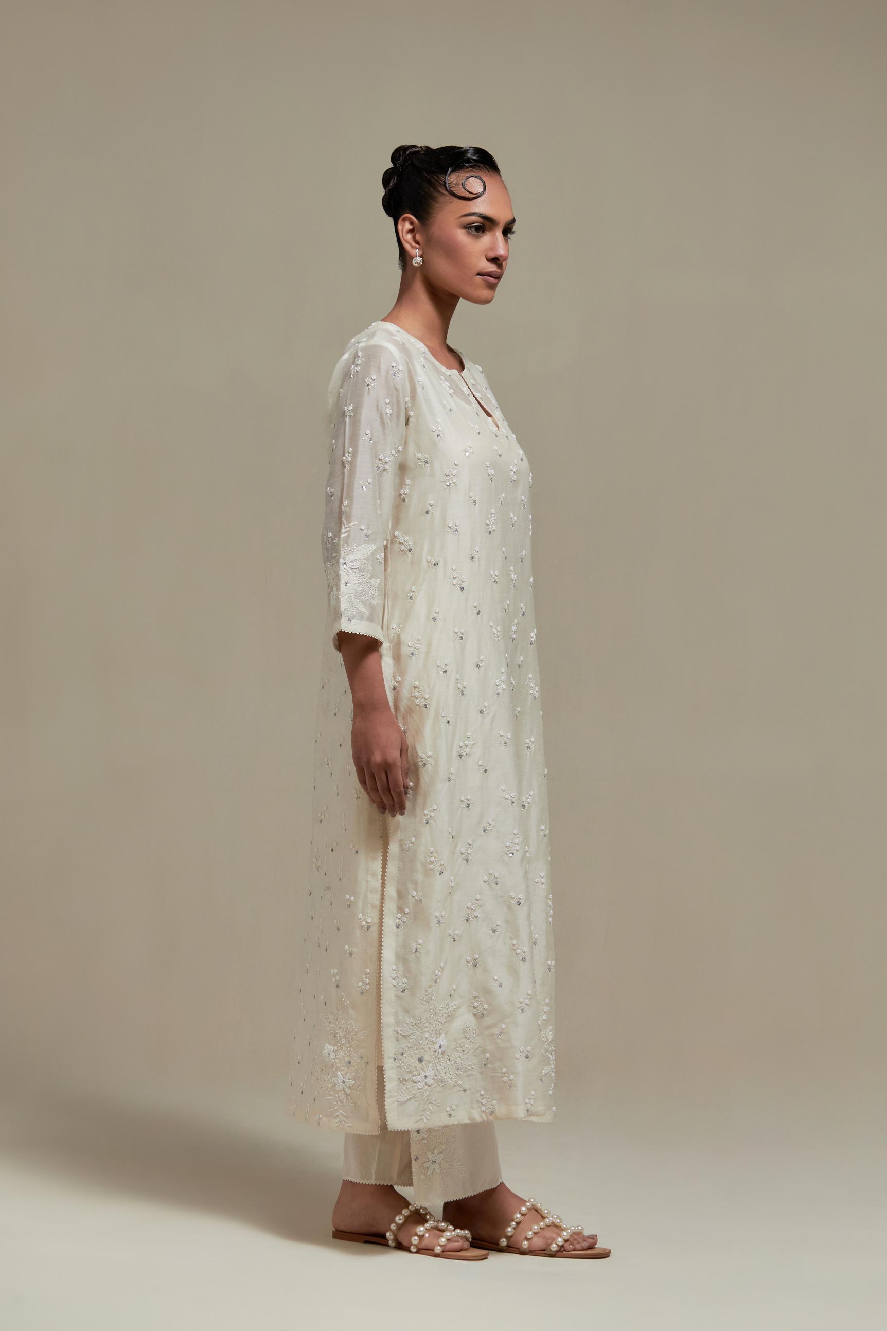 Off white silk Chanderi straight kurta set with all-over delicate embroidered flowers, highlighted with sequins and beads.