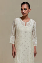 Off white silk Chanderi straight kurta set with all-over delicate embroidered flowers, highlighted with sequins and beads.