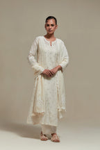 Off white silk Chanderi straight kurta set with all-over delicate embroidered flowers, highlighted with sequins and beads.
