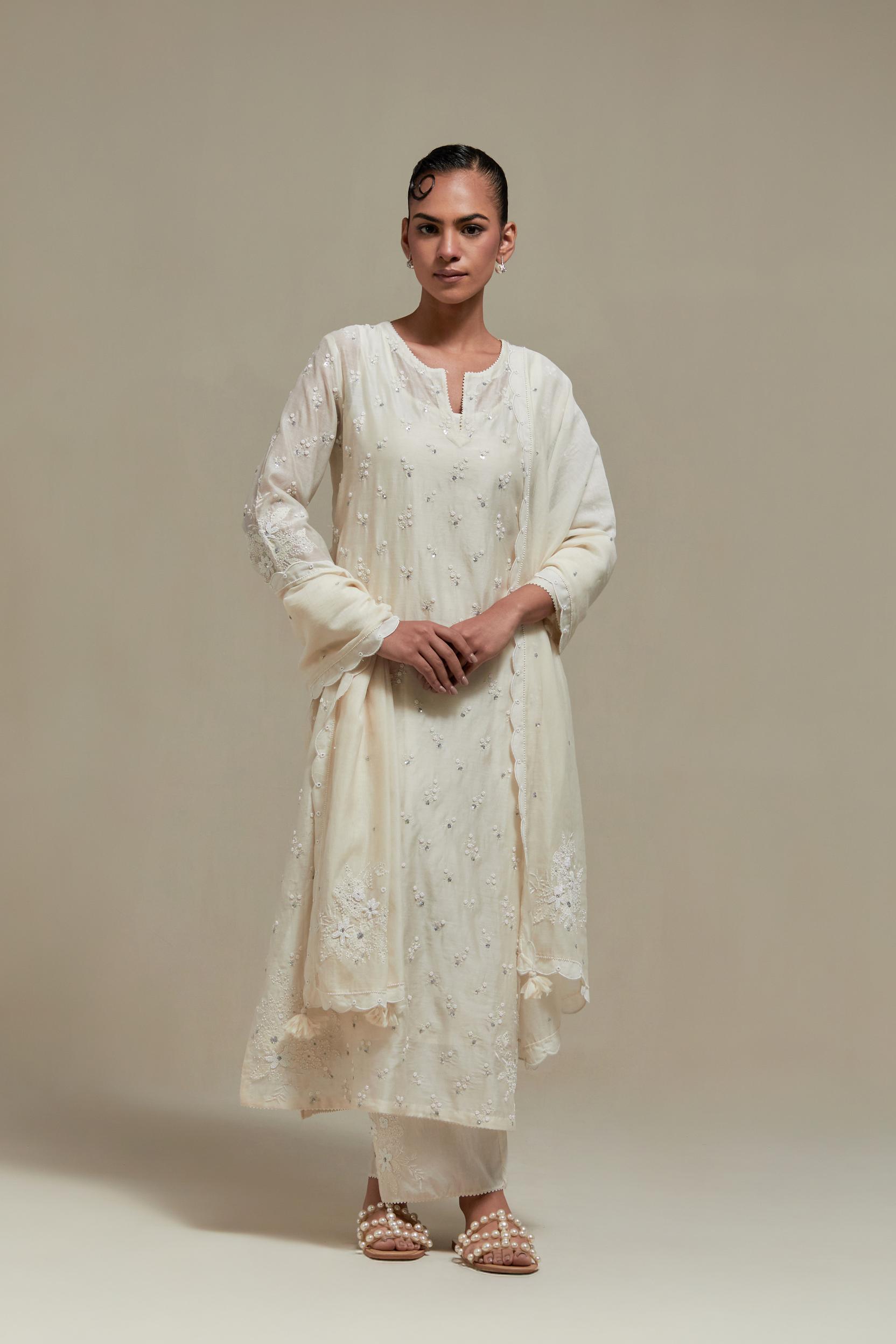 Off white silk Chanderi straight kurta set with all-over delicate embroidered flowers, highlighted with sequins and beads.