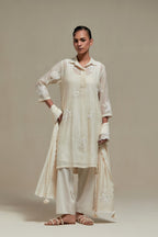 Off white cotton Chanderi short shirt-kurta set with all-over appliqué flowers, highlighted with sequins and beads.