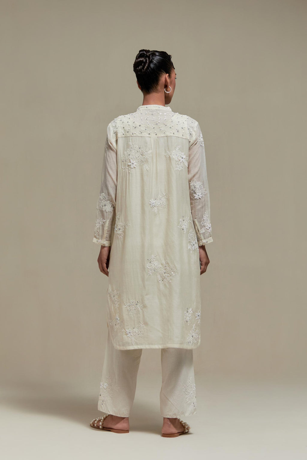 Off white cotton Chanderi short kurta set with all-over appliqué, highlighted with sequins and beads.