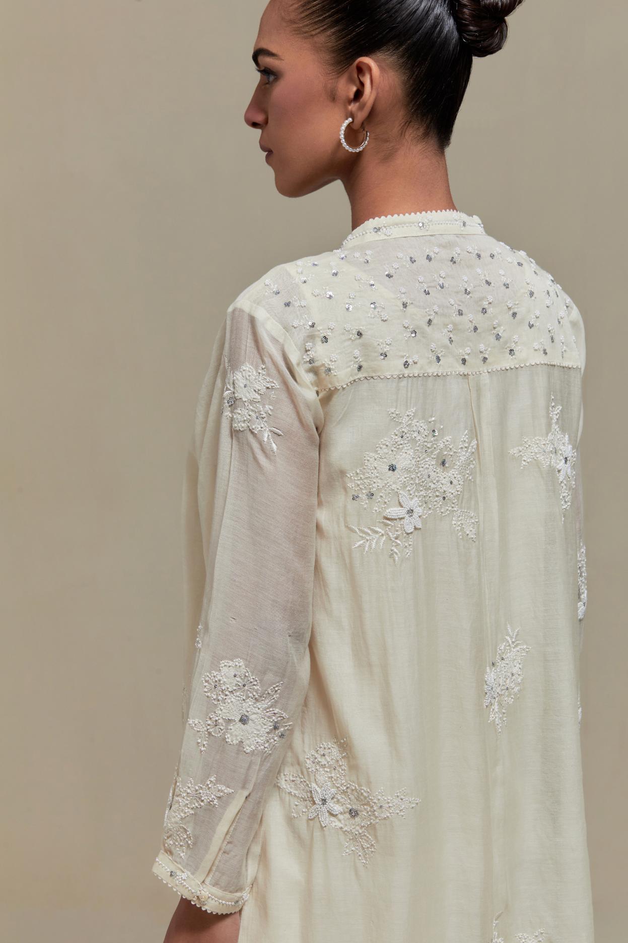 Off white cotton Chanderi short kurta set with all-over appliqué, highlighted with sequins and beads.