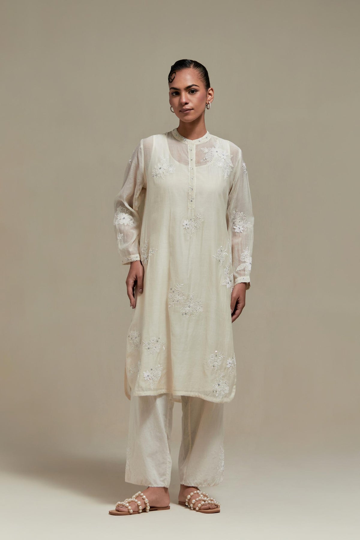 Off white cotton Chanderi short kurta set with all-over appliqué, highlighted with sequins and beads.