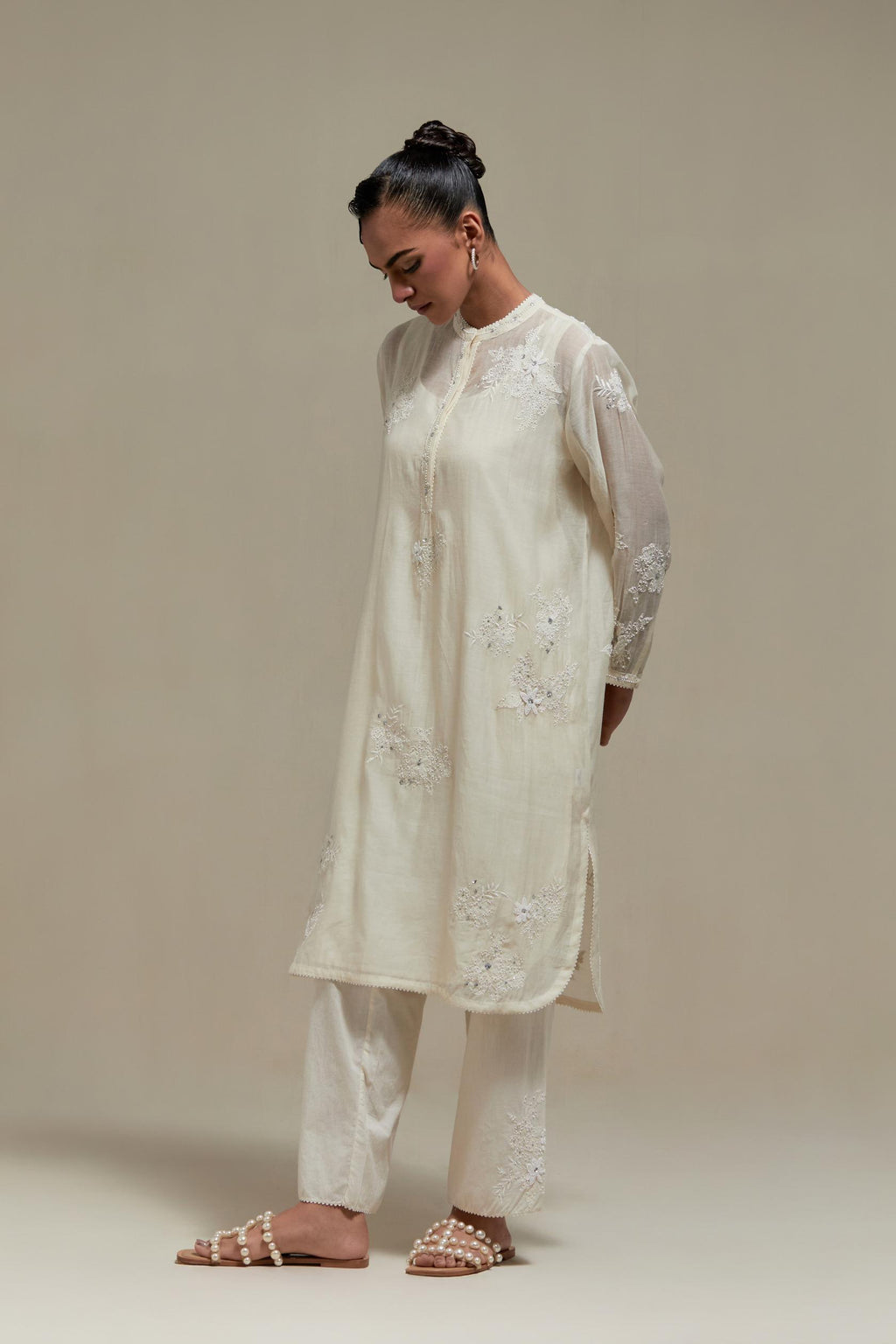 Off white cotton Chanderi short kurta set with all-over appliqué, highlighted with sequins and beads.