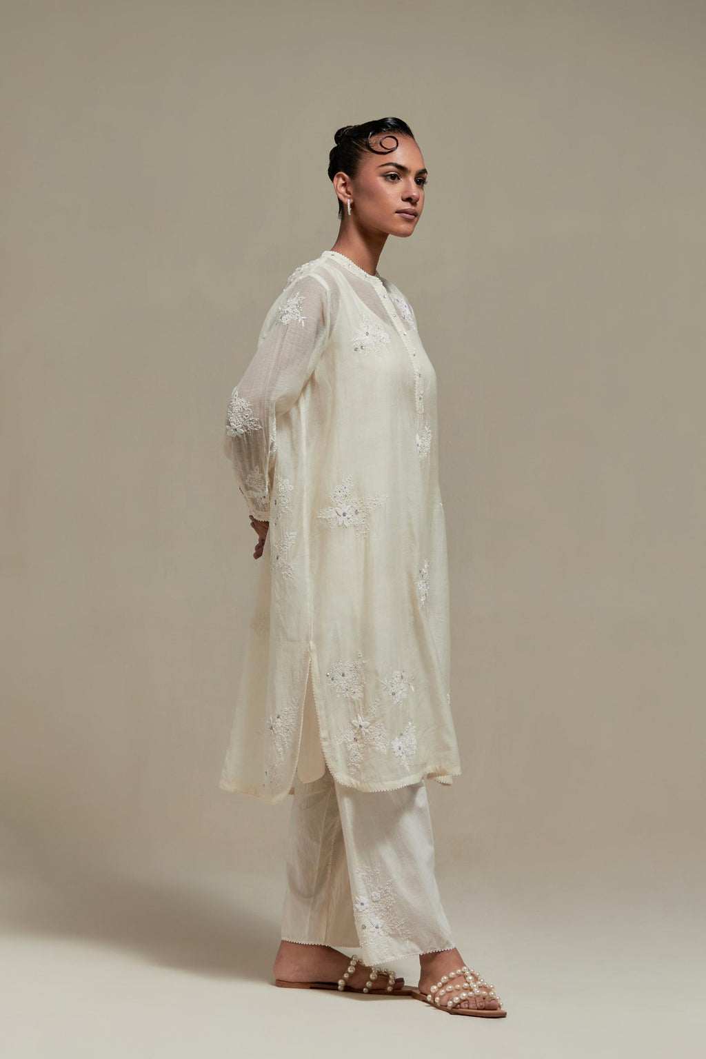 Off white cotton Chanderi short kurta set with all-over appliqué, highlighted with sequins and beads.