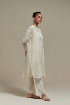 Off white cotton Chanderi short kurta set with all-over appliqué, highlighted with sequins and beads.