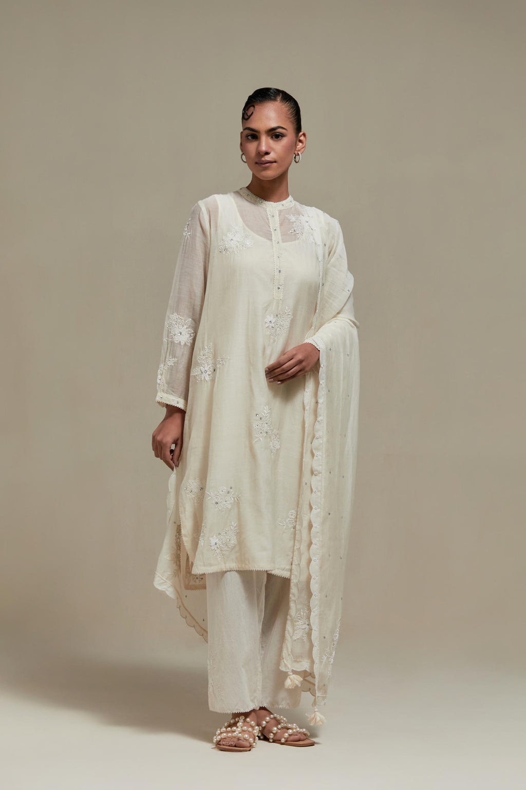 Off white cotton Chanderi short kurta set with all-over appliqué, highlighted with sequins and beads.