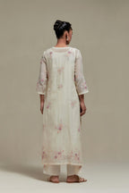 Off white straight kurta set with all-over pink & beige hand block printed appliqué motifs, highlighted with sequins and multi coloured beads.