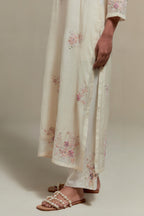 Off white straight kurta set with all-over pink & beige hand block printed appliqué motifs, highlighted with sequins and multi coloured beads.