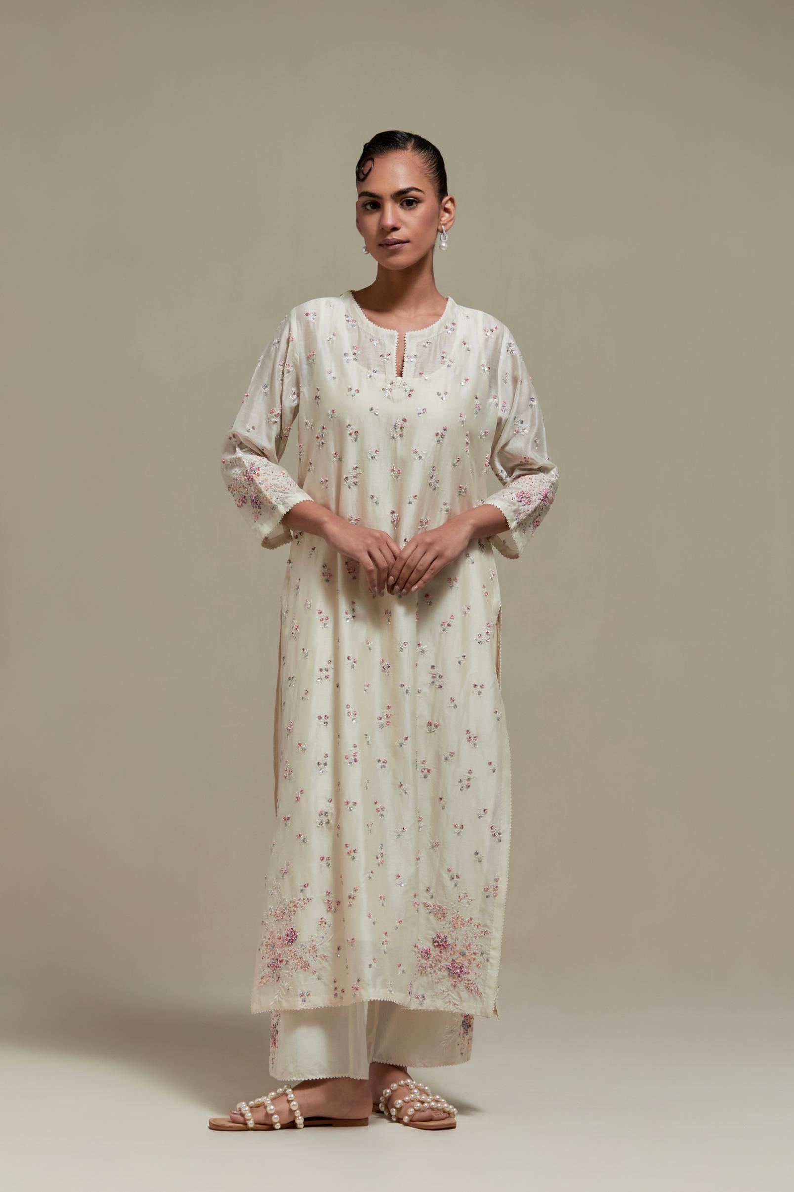 Off white silk Chanderi straight kurta set with all-over delicate embroidered flowers, highlighted with sequins and multi coloured beads.