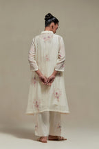 Off white cotton Chanderi short shirt-kurta set with all-over pink & beige hand block printed appliqué flowers, highlighted with sequins and multi-coloured beads.