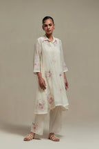 Off white cotton Chanderi short shirt-kurta set with all-over pink & beige hand block printed appliqué flowers, highlighted with sequins and multi-coloured beads.