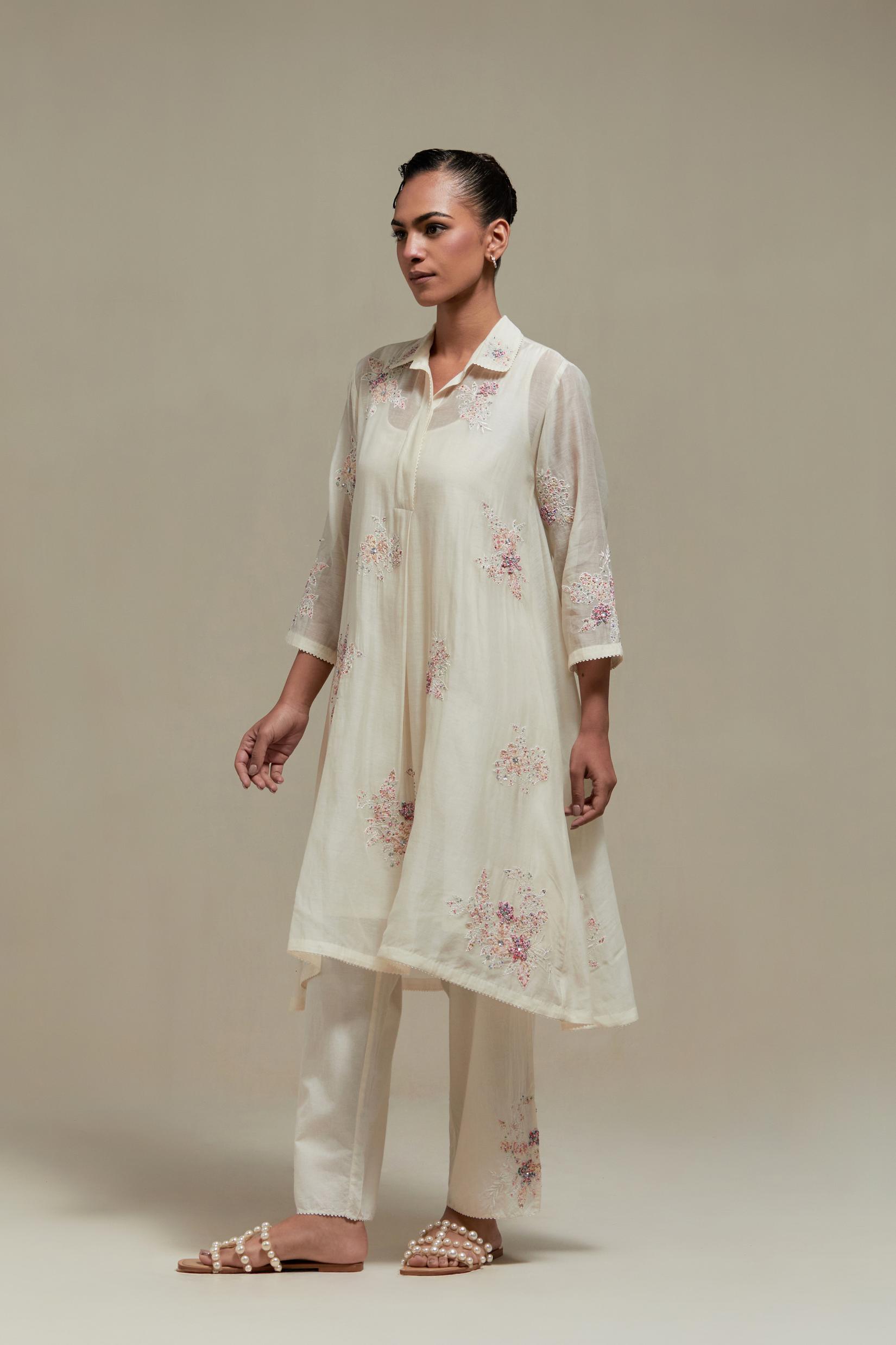 Off white cotton Chanderi short shirt-kurta set with all-over pink & beige hand block printed appliqué flowers, highlighted with sequins and multi-coloured beads.