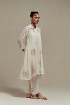 Off white cotton Chanderi short shirt-kurta set with all-over pink & beige hand block printed appliqué flowers, highlighted with sequins and multi-coloured beads.