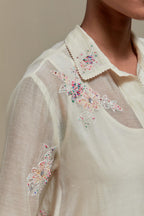 Off white cotton Chanderi short shirt-kurta set with all-over pink & beige hand block printed appliqué flowers, highlighted with sequins and multi-coloured beads.