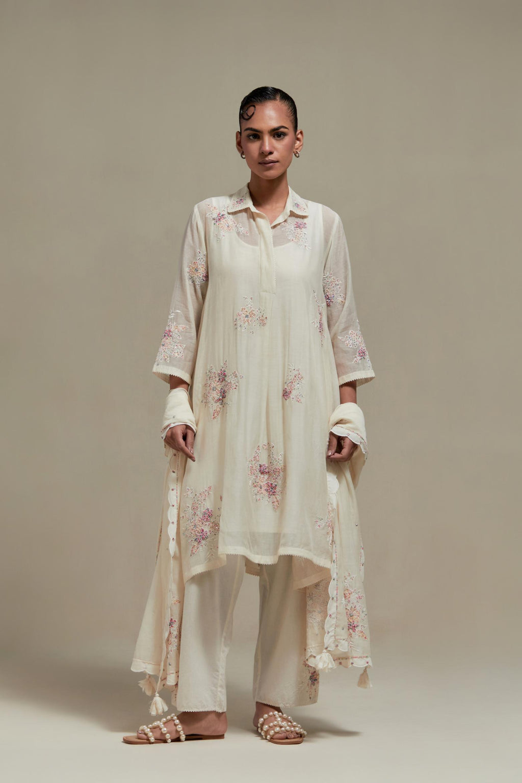 Off white cotton Chanderi short shirt-kurta set with all-over pink & beige hand block printed appliqué flowers, highlighted with sequins and multi-coloured beads.