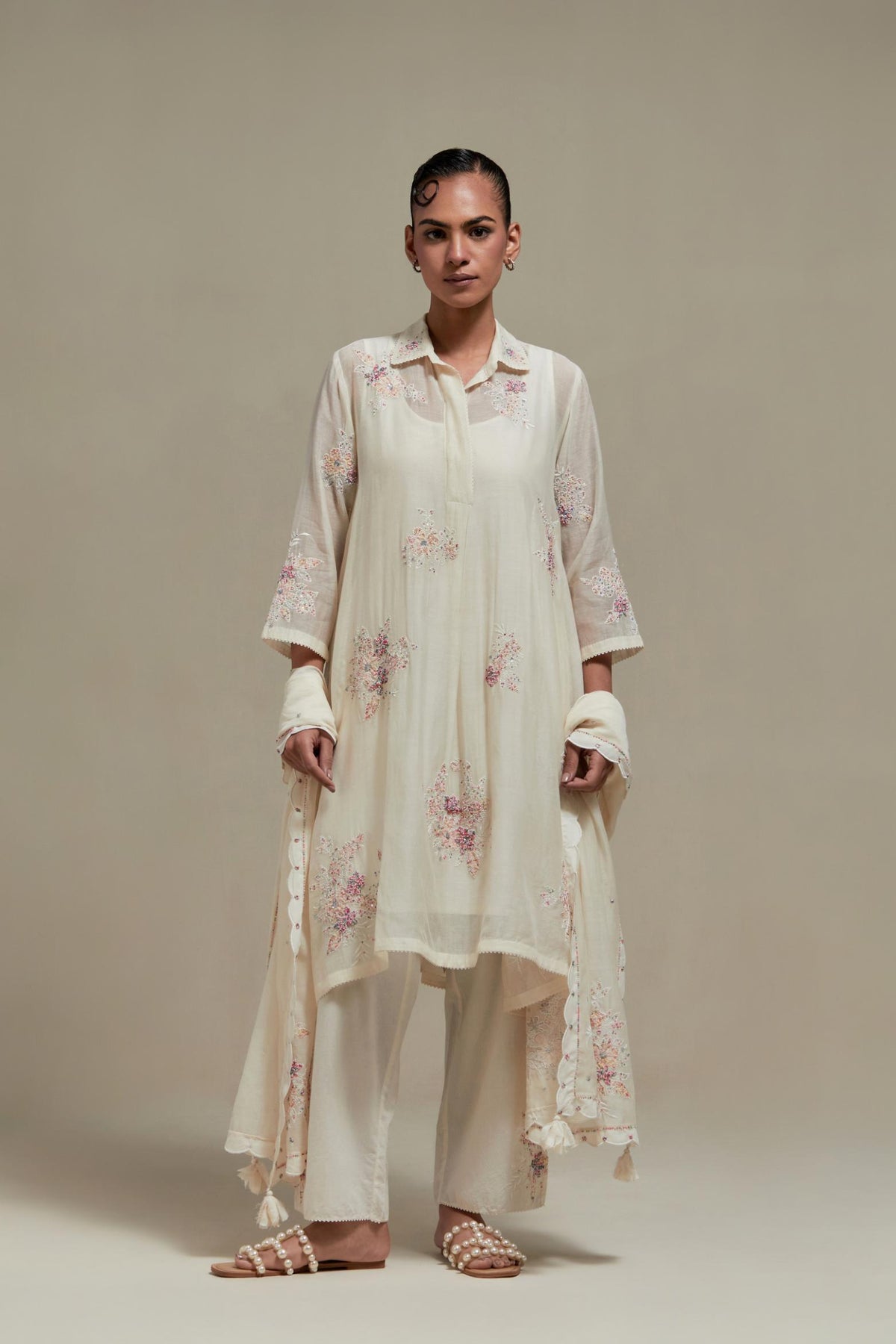 Off white cotton Chanderi short shirt-kurta set with all-over pink & beige hand block printed appliqué flowers, highlighted with sequins and multi-coloured beads.