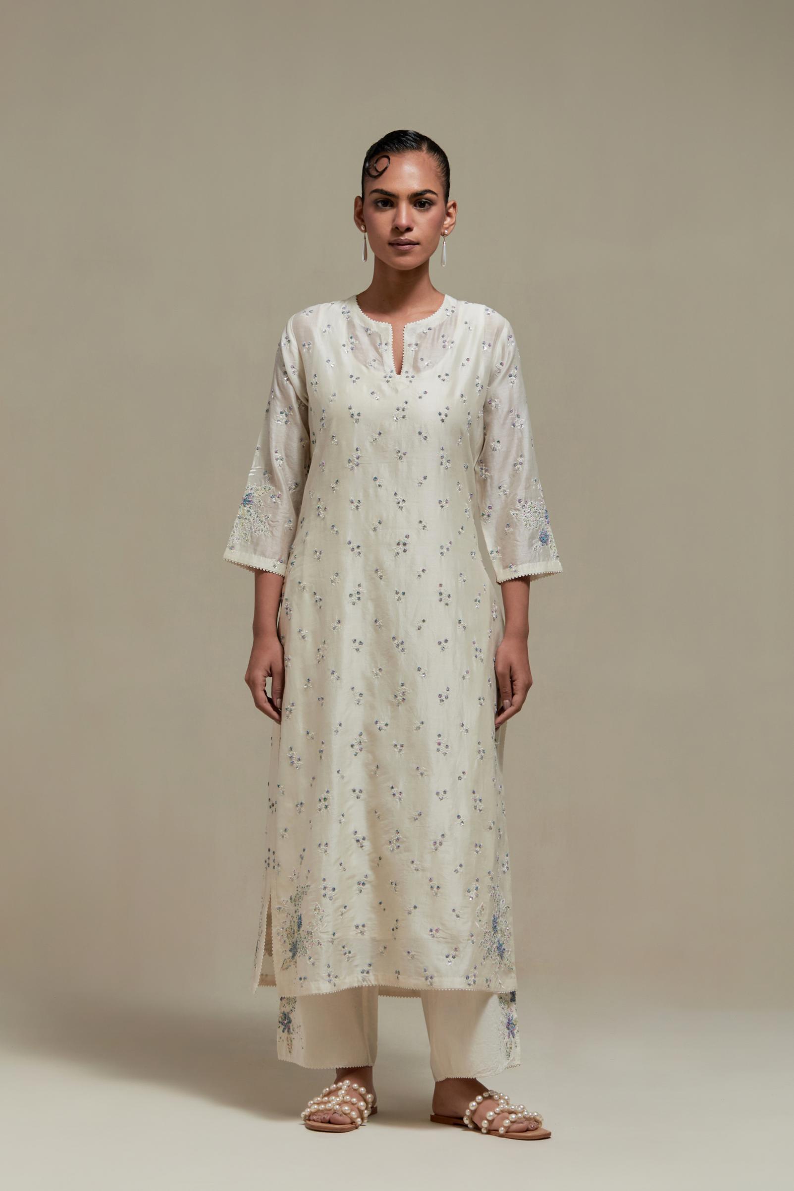 Off white silk Chanderi straight kurta set with all-over delicate embroidered flowers, highlighted with sequins and multi coloured beads.