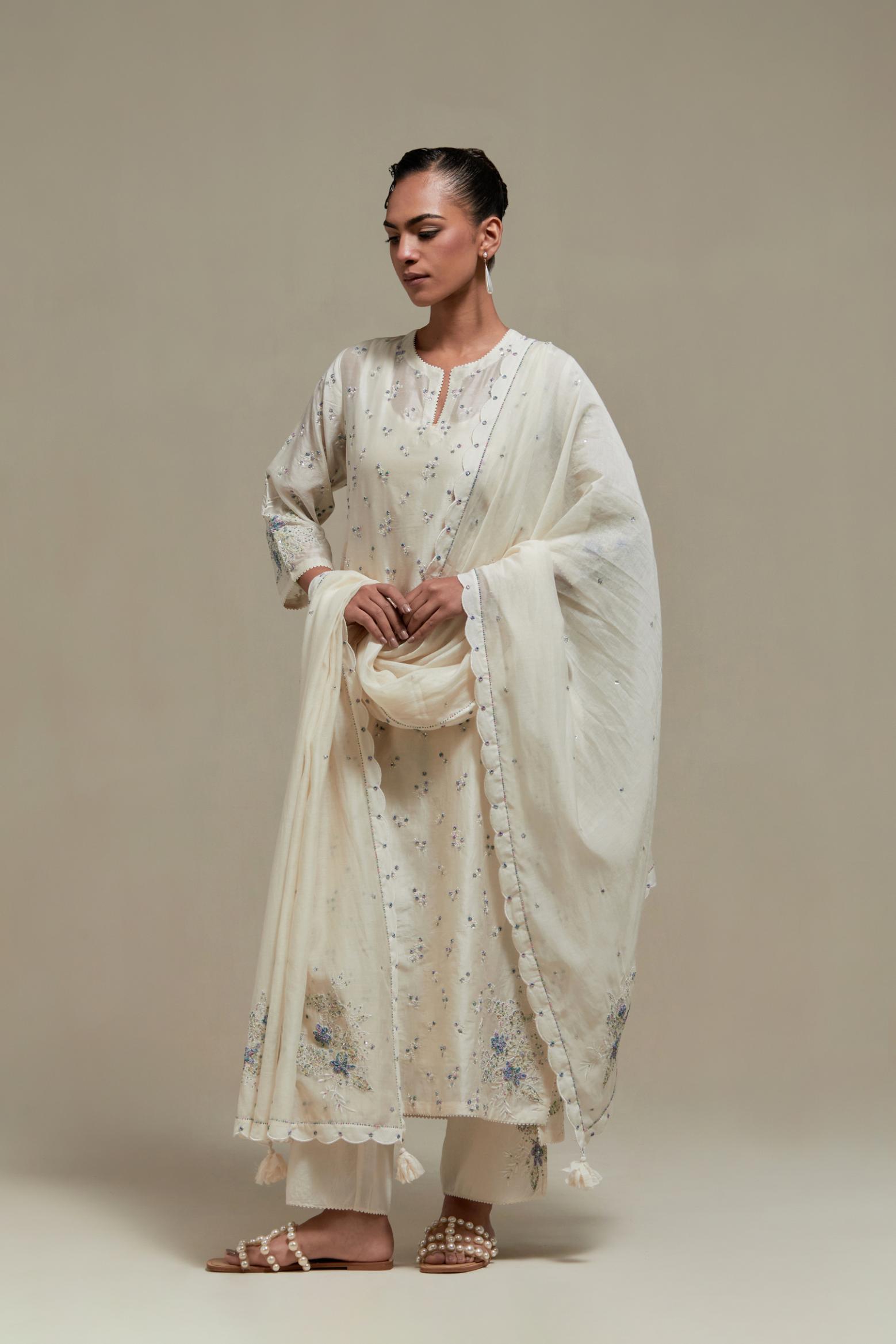 Off white silk Chanderi straight kurta set with all-over delicate embroidered flowers, highlighted with sequins and multi coloured beads.