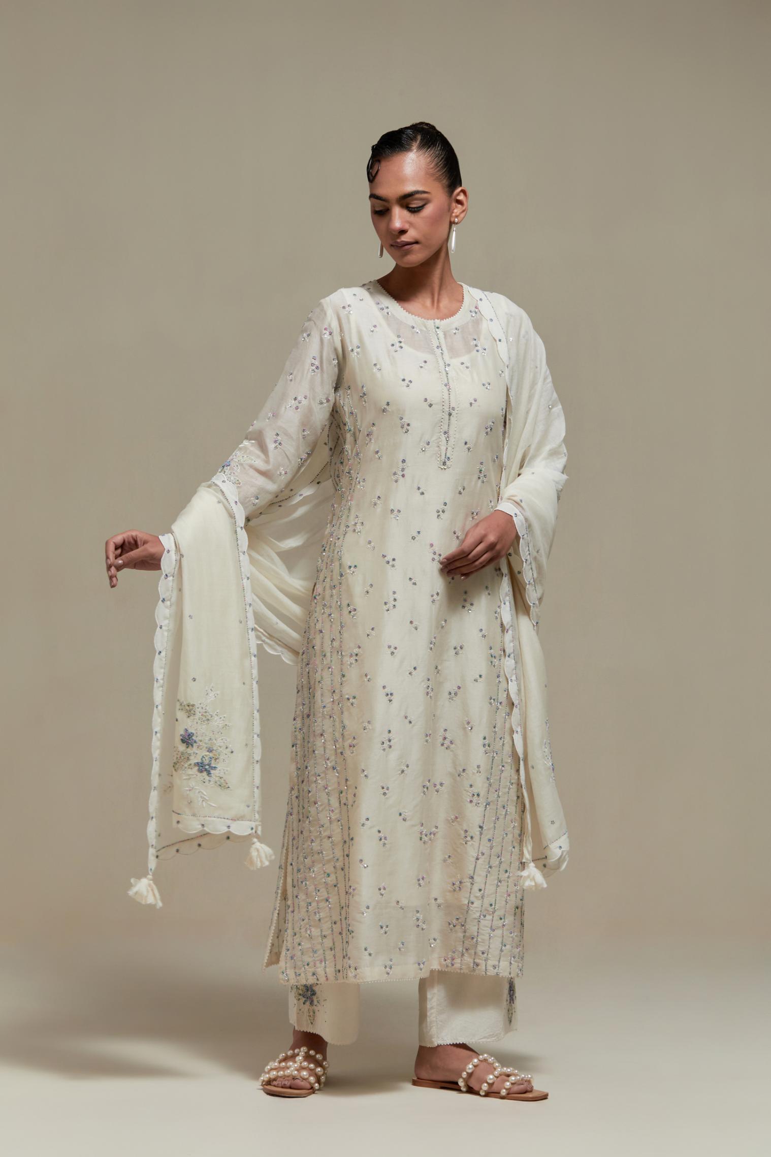 Off white silk Chanderi straight kurta set with all-over delicate embroidered flowers, highlighted with sequins and multi coloured beads.