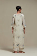 Off white straight kurta set with all-over blue & beige hand block printed appliqué motifs, highlighted with sequins and multi coloured beads.