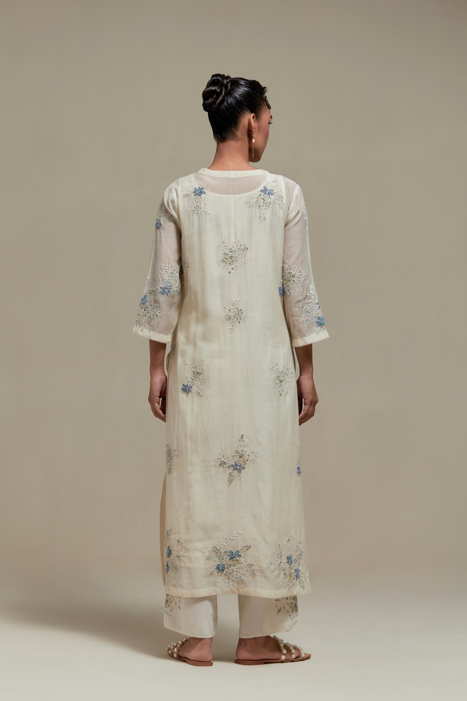 Off white straight kurta set with all-over blue & beige hand block printed appliqué motifs, highlighted with sequins and multi coloured beads.