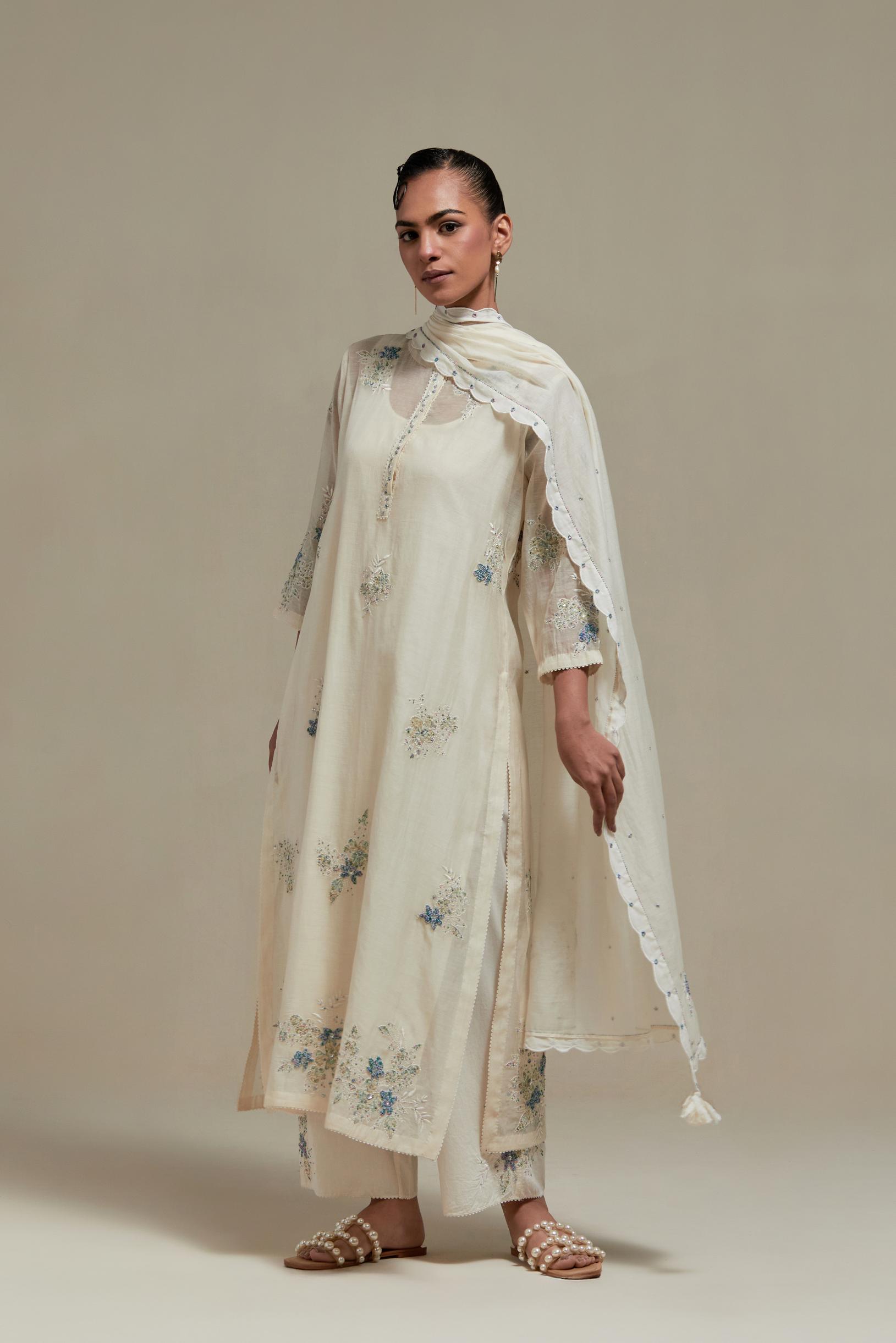 Off white straight kurta set with all-over blue & beige hand block printed appliqué motifs, highlighted with sequins and multi coloured beads.