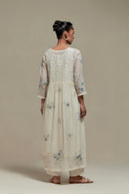 Off white cotton Chanderi kurta dress set with delicate embroidered flowers and blue & beige hand block printed appliqué motifs, highlighted with sequins and multi coloured beads.