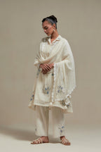 Off white cotton Chanderi short shirt-kurta set with all-over blue & beige hand block printed appliqué flowers, highlighted with sequins and multi-coloured beads.