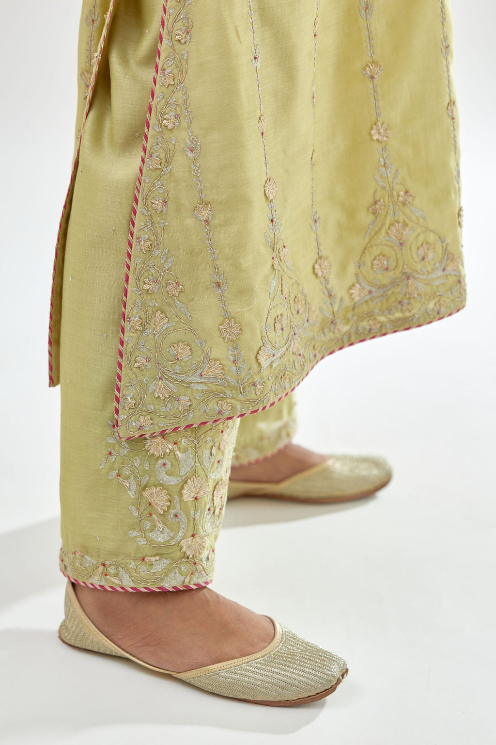 Green silk chanderi straight kurta set with all over heavy dori and gota embroidery work, highlighted with contrast bead work.