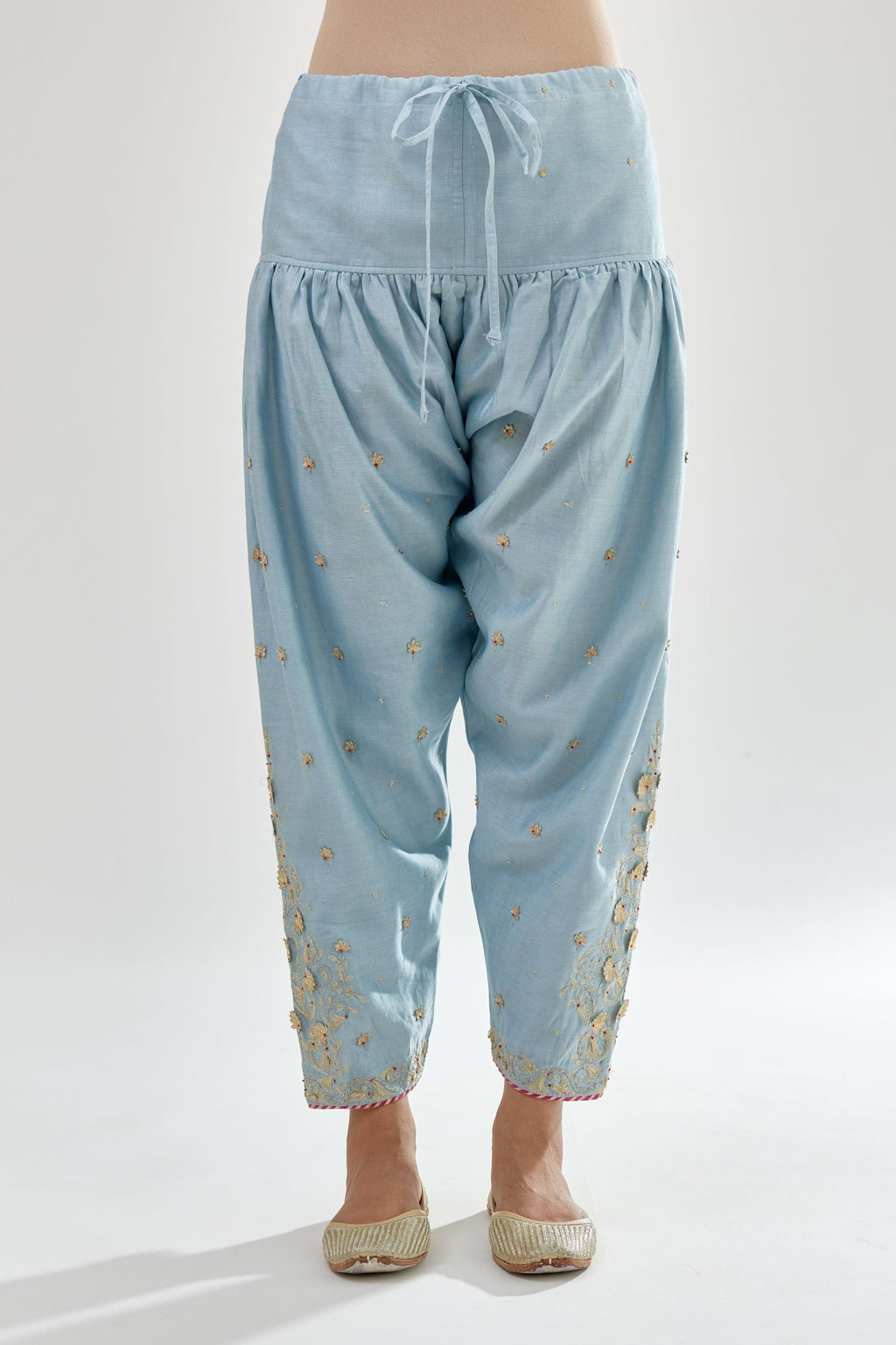 Blue silk chanderi salwar, detailed with zari, dori, bead and gota embroidered boota at sides.