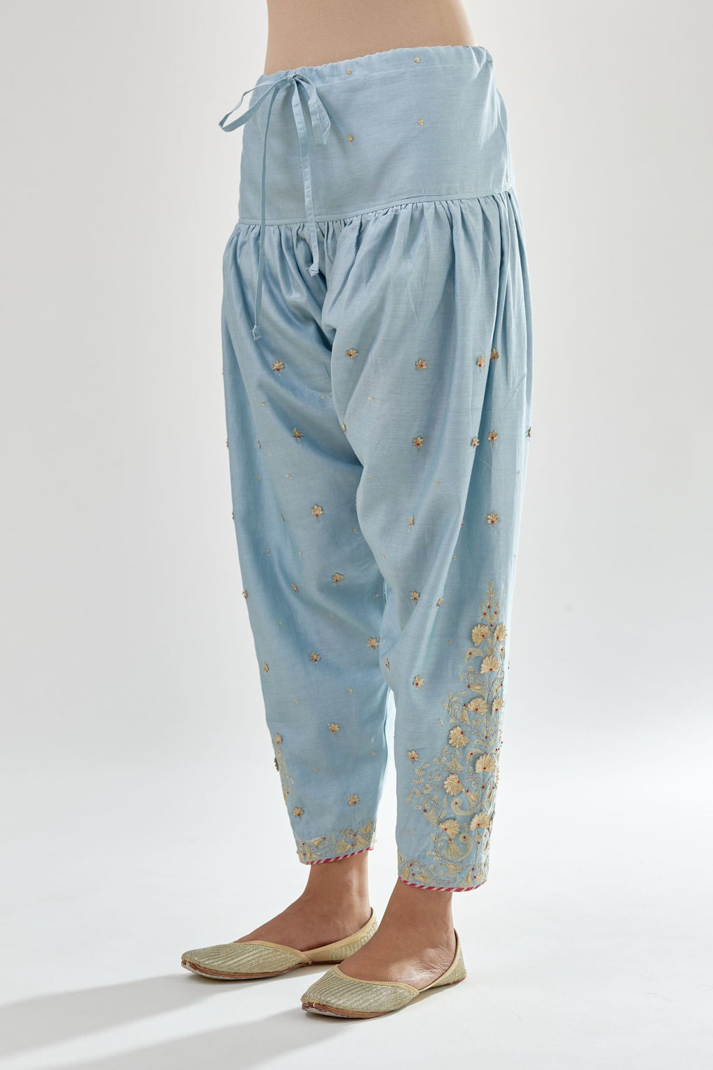 Blue silk chanderi salwar, detailed with zari, dori, bead and gota embroidered boota at sides.