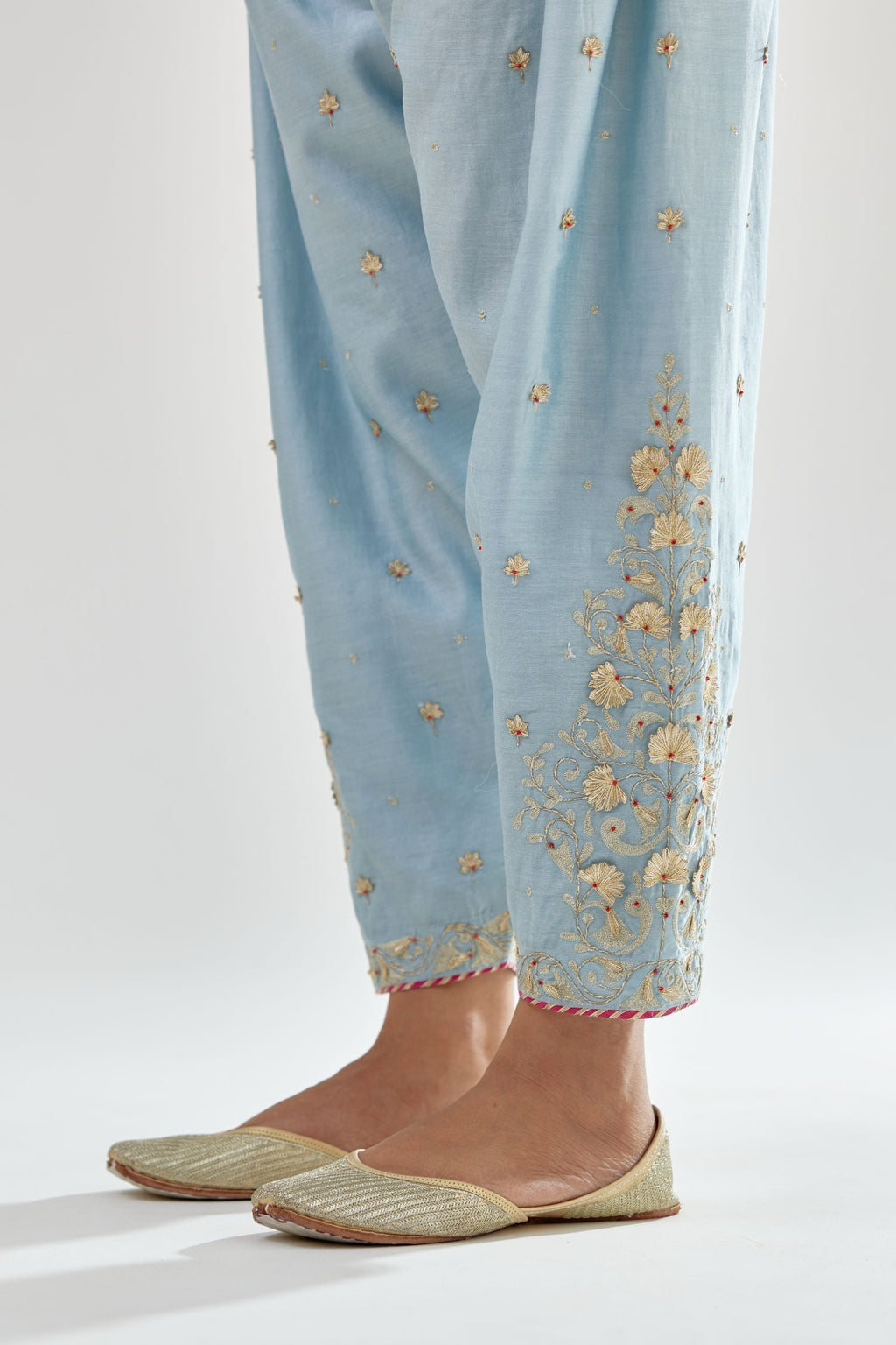 Blue silk chanderi salwar, detailed with zari, dori, bead and gota embroidered boota at sides.