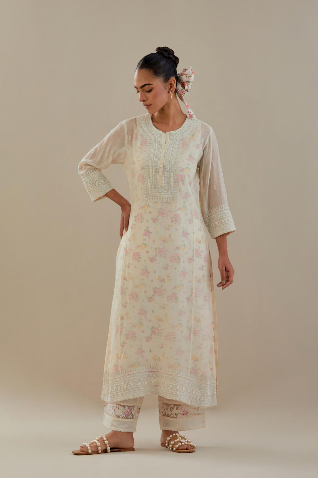Off white cotton chanderi straight kurta set with heavy embroidered button placket neckline and delicate bead, tassel work at side panel joint seams.