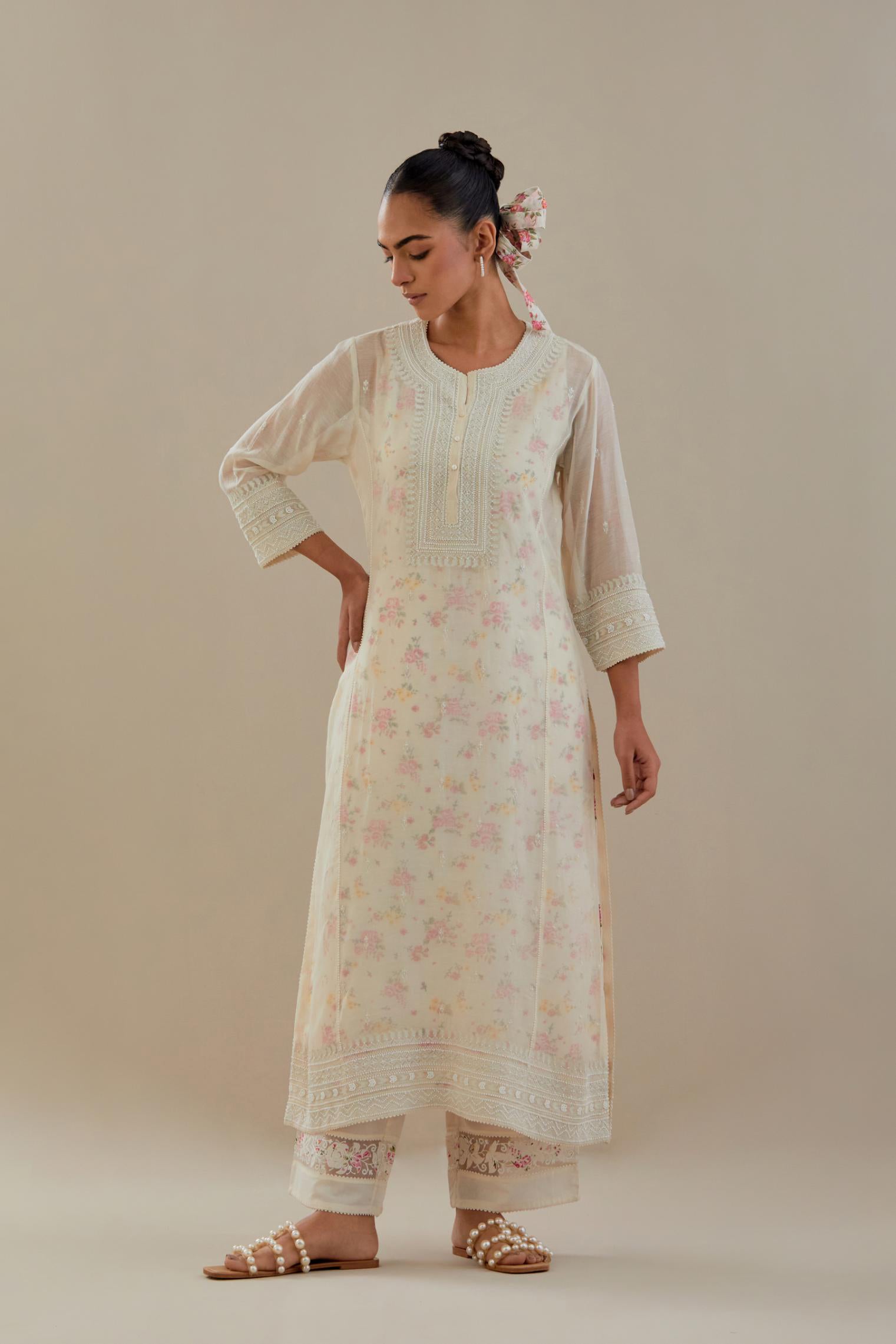 Off white cotton chanderi straight kurta set with heavy embroidered button placket neckline and delicate bead, tassel work at side panel joint seams.