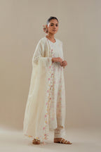 Off white cotton chanderi straight kurta set with heavy embroidered button placket neckline and delicate bead, tassel work at side panel joint seams.
