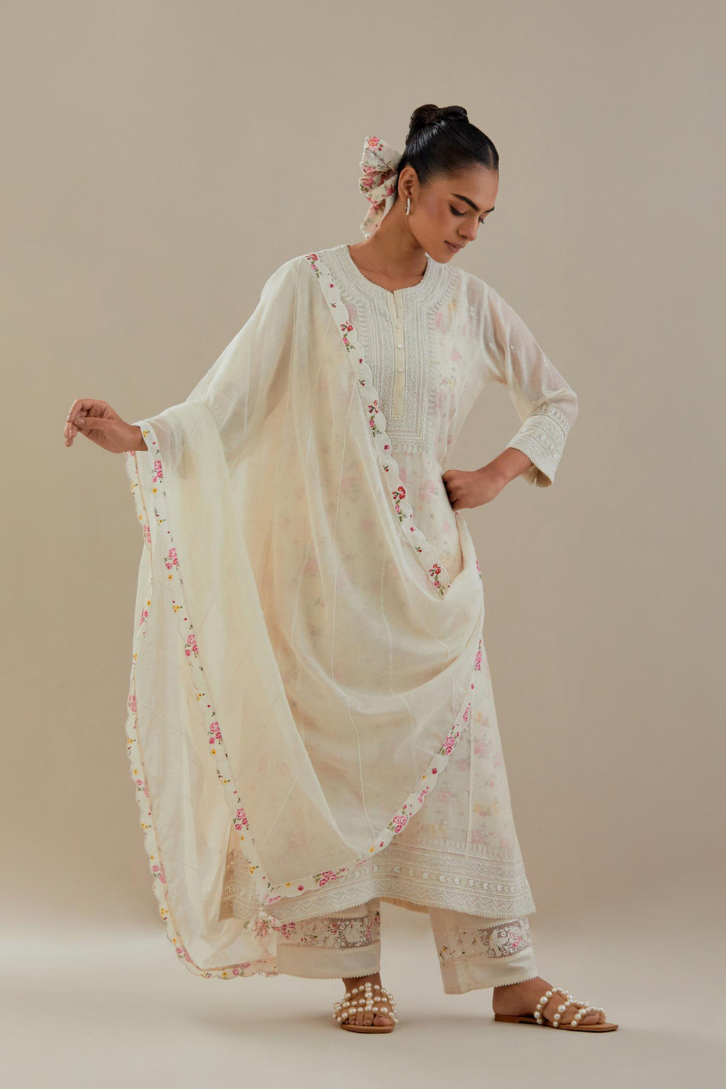 Off white cotton chanderi straight kurta set with heavy embroidered button placket neckline and delicate bead, tassel work at side panel joint seams.