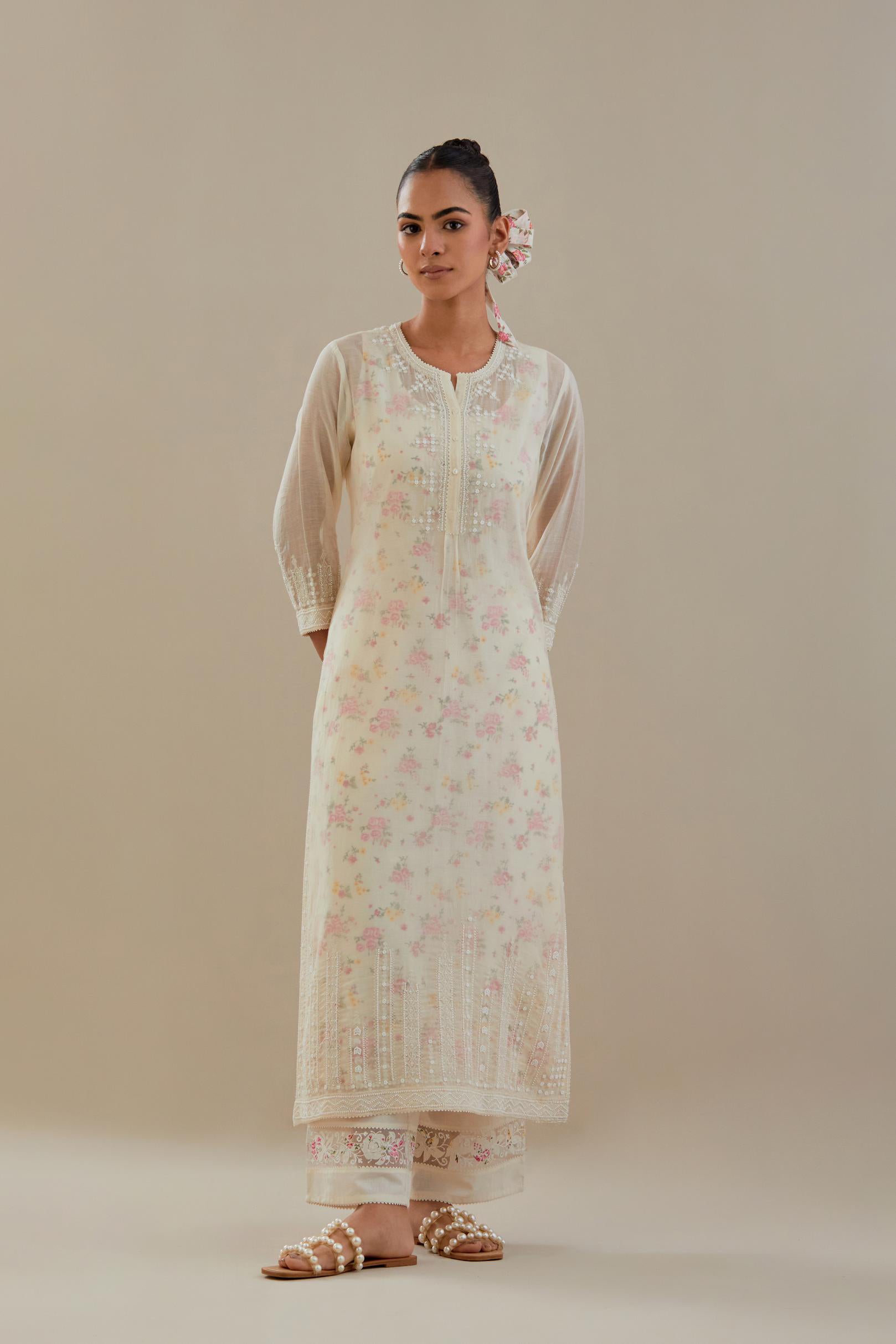 Off white cotton chanderi straight kurta set with off white thread embroidery, highlighted with delicate beaded hand work at neck, sleeve and hem.