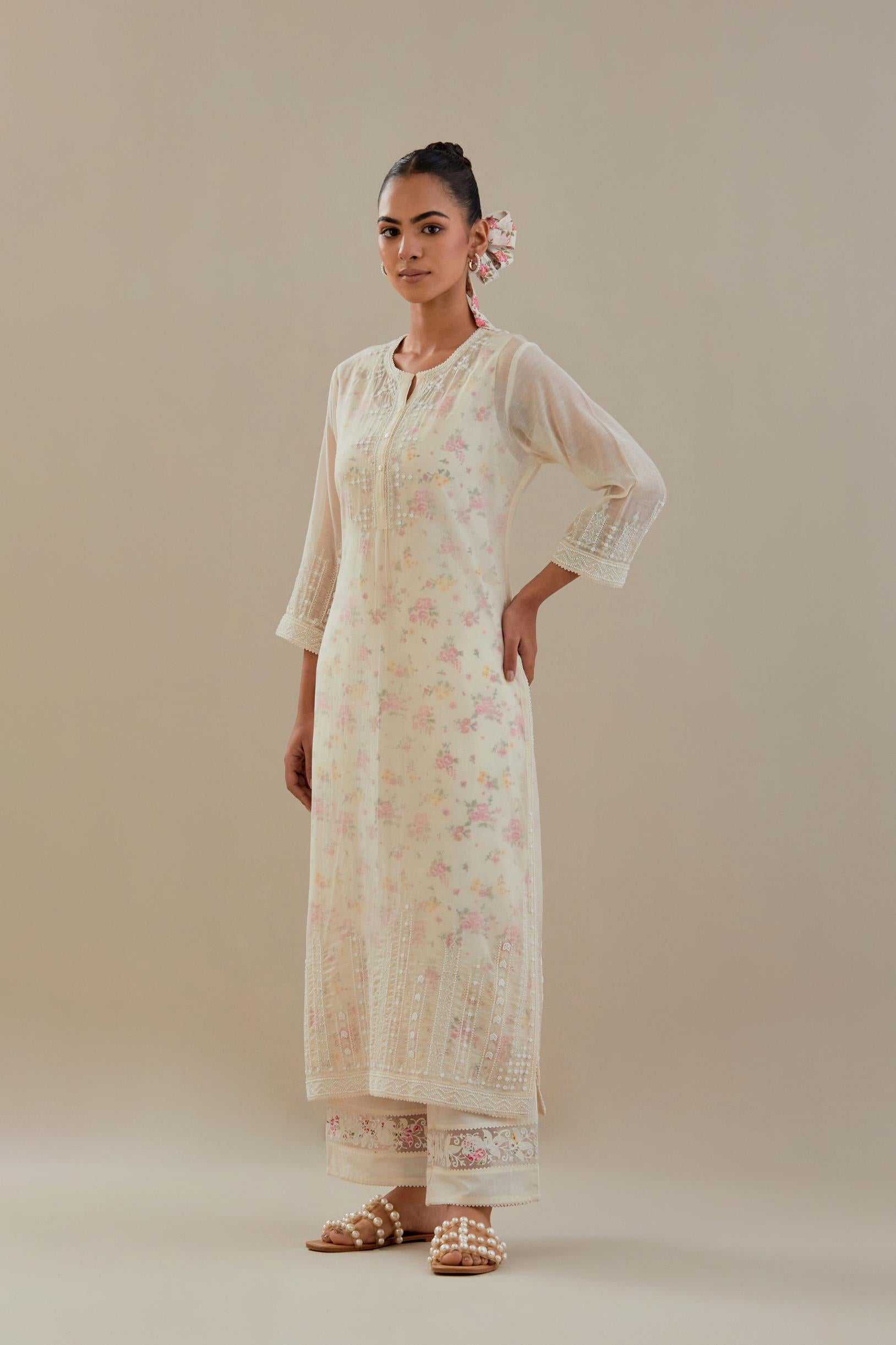 Off white cotton chanderi straight kurta set with off white thread embroidery, highlighted with delicate beaded hand work at neck, sleeve and hem.