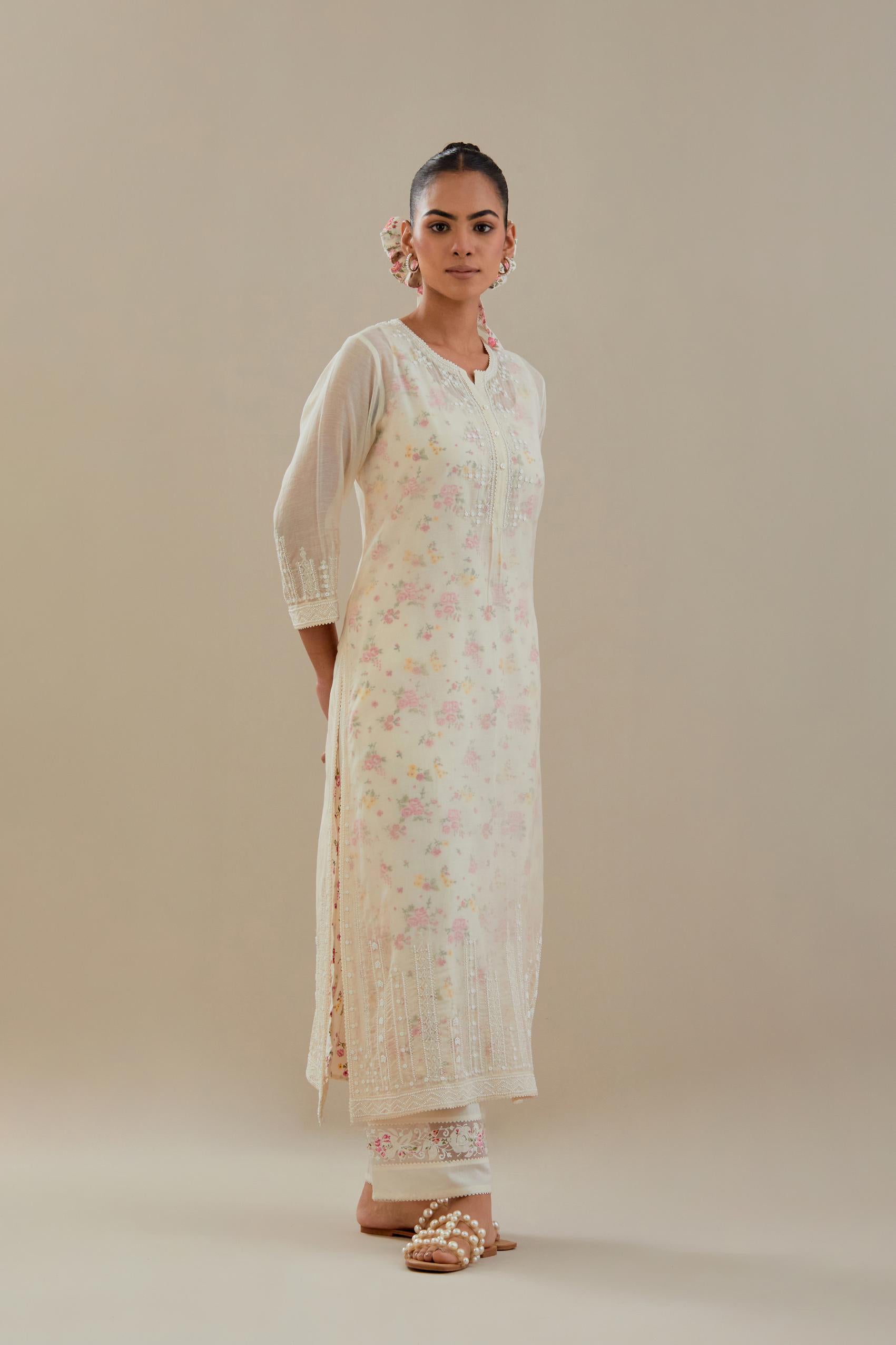 Off white cotton chanderi straight kurta set with off white thread embroidery, highlighted with delicate beaded hand work at neck, sleeve and hem.
