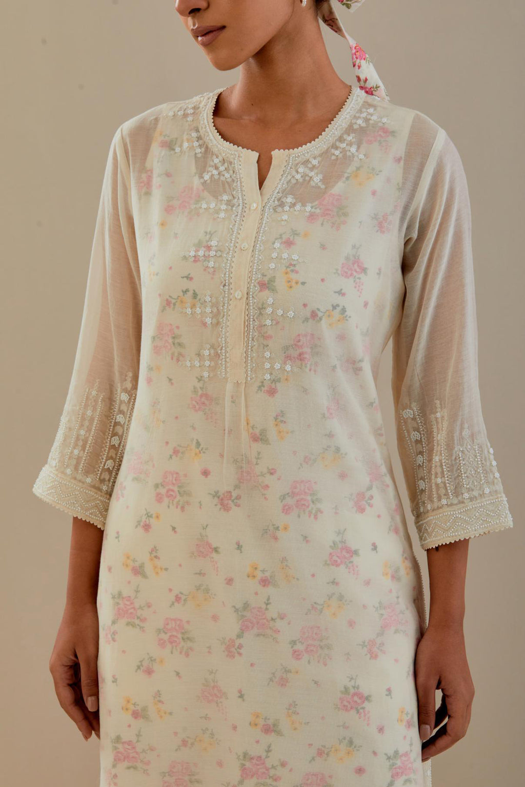 Off white cotton chanderi straight kurta set with off white thread embroidery, highlighted with delicate beaded hand work at neck, sleeve and hem.