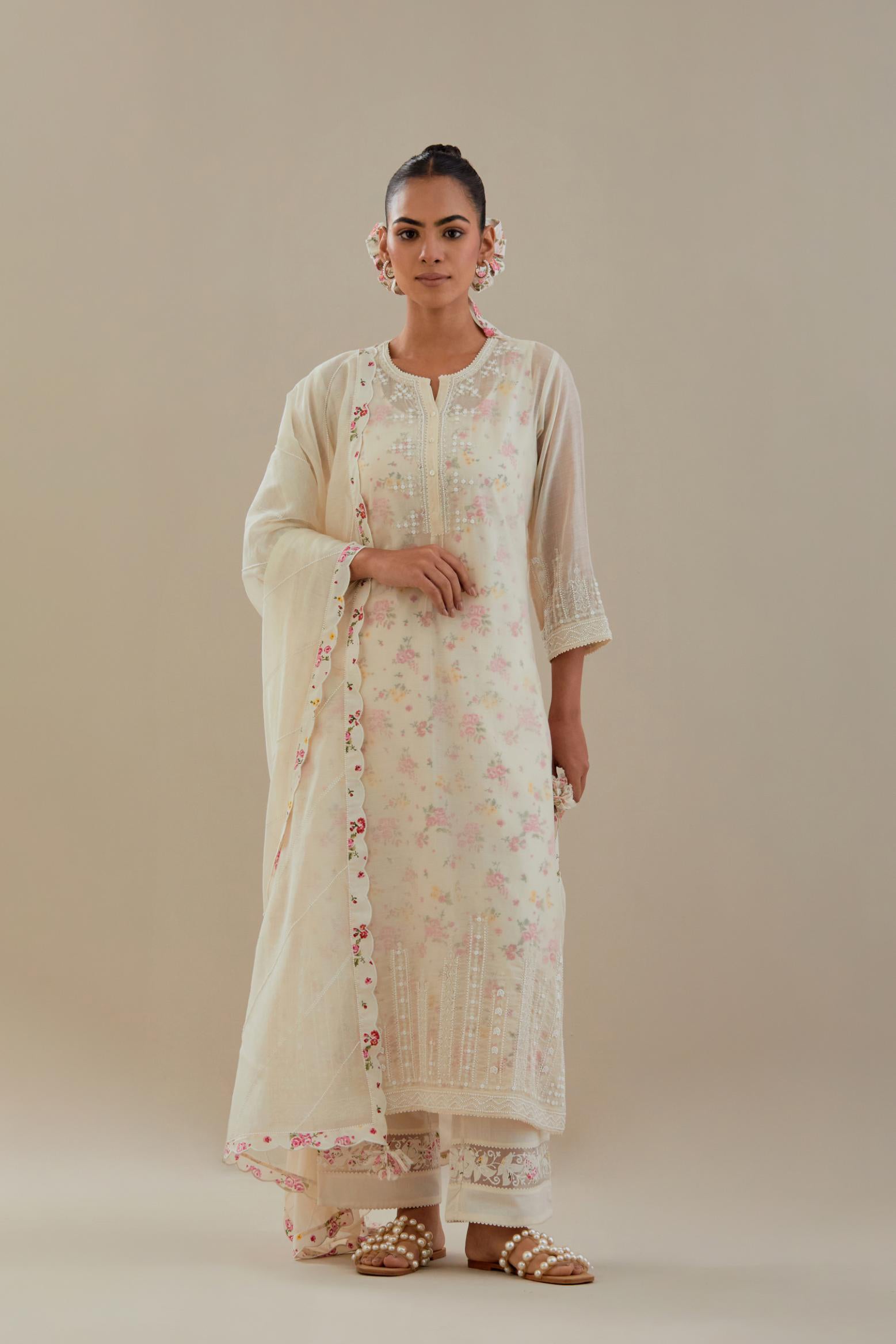 Off white cotton chanderi straight kurta set with off white thread embroidery, highlighted with delicate beaded hand work at neck, sleeve and hem.