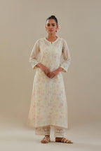 Off white cotton chanderi straight kurta set with embroidered button placket neckline and delicate bead, thread tassel work at side panel joint seams.