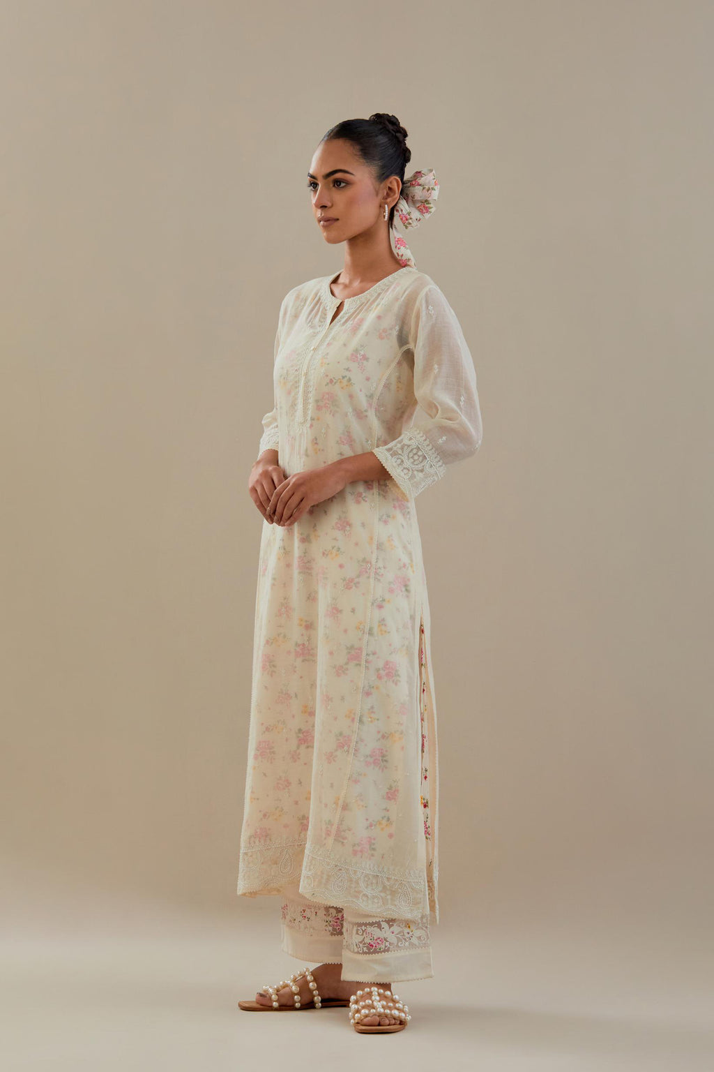 Off white cotton chanderi straight kurta set with embroidered button placket neckline and delicate bead, thread tassel work at side panel joint seams.