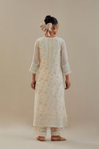 Off white cotton chanderi straight kurta set with off white thread embroidery and delicate beaded hand work at neck, sleeve and hem.