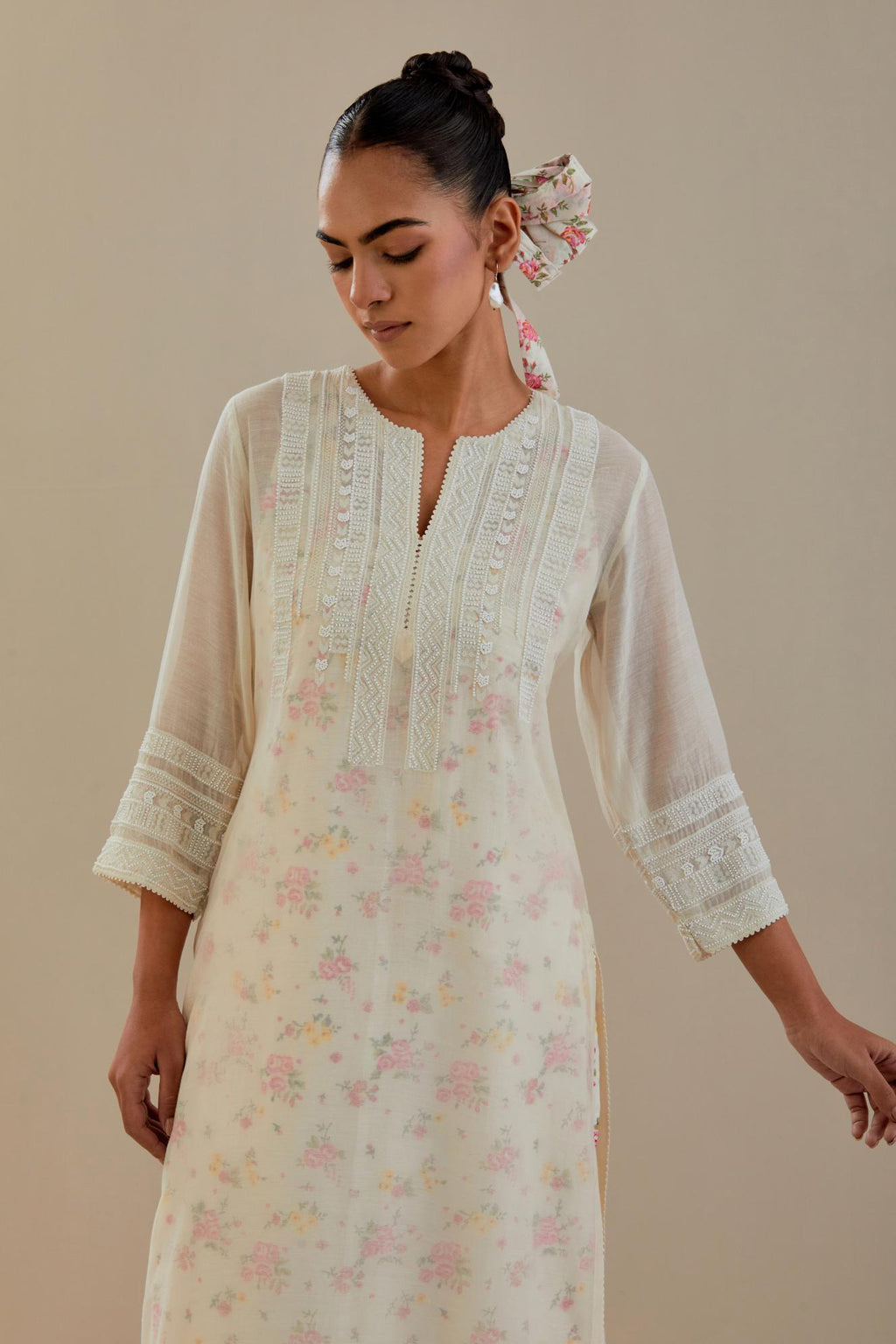 Off white cotton chanderi straight kurta set with off white thread embroidery and delicate beaded hand work at neck, sleeve and hem.