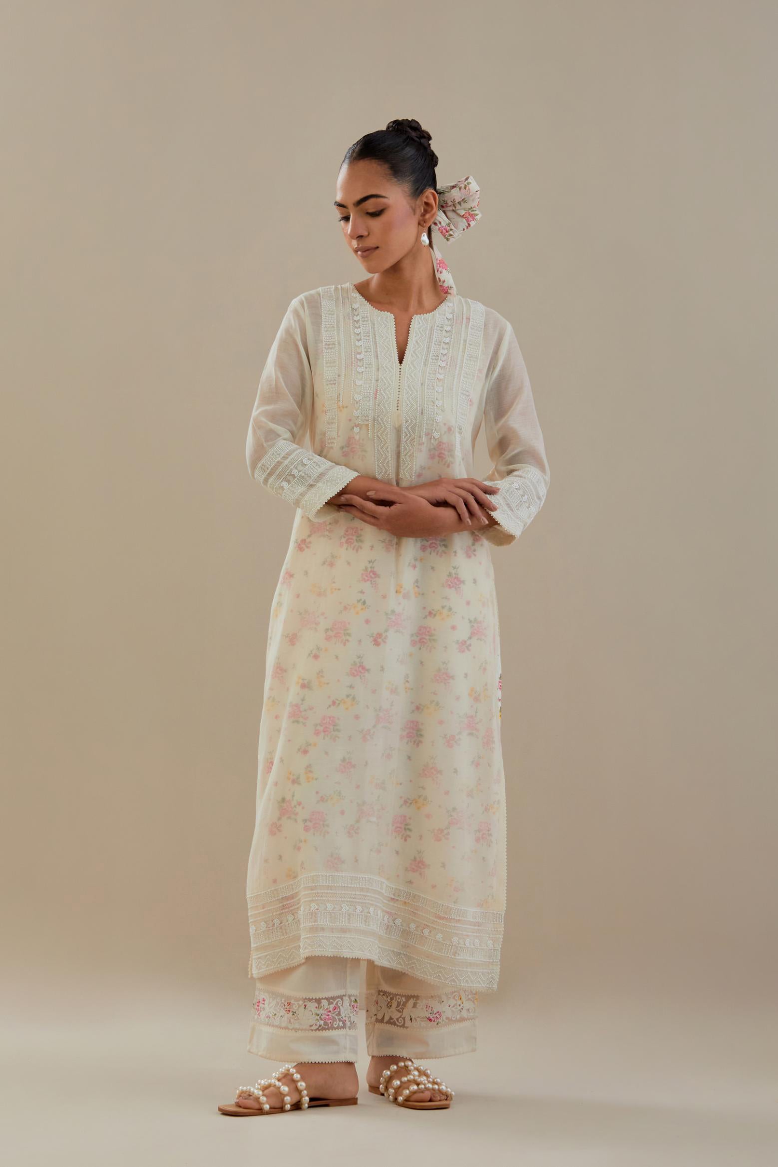Off white cotton chanderi straight kurta set with off white thread embroidery and delicate beaded hand work at neck, sleeve and hem.
