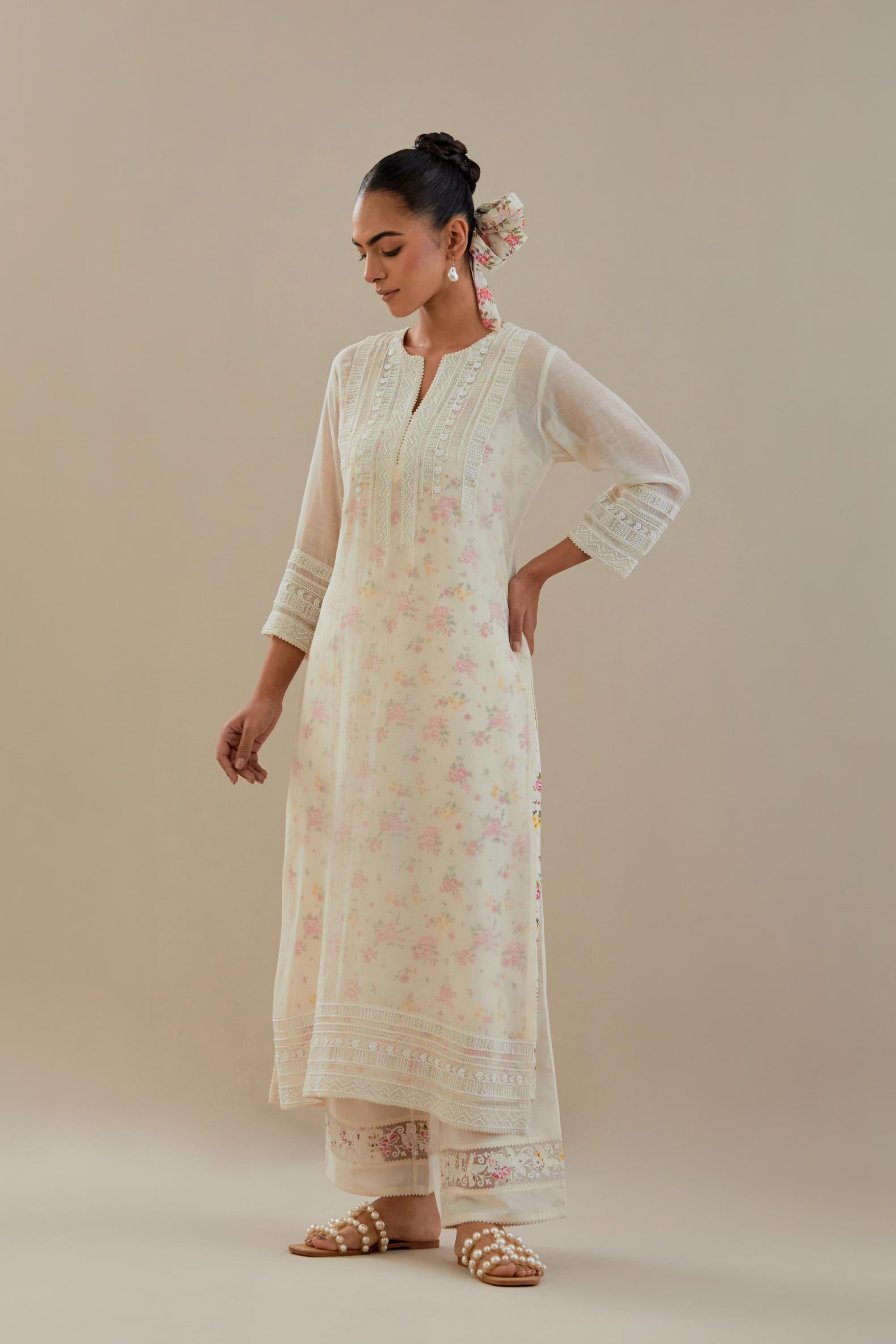 Off white cotton chanderi straight kurta set with off white thread embroidery and delicate beaded hand work at neck, sleeve and hem.